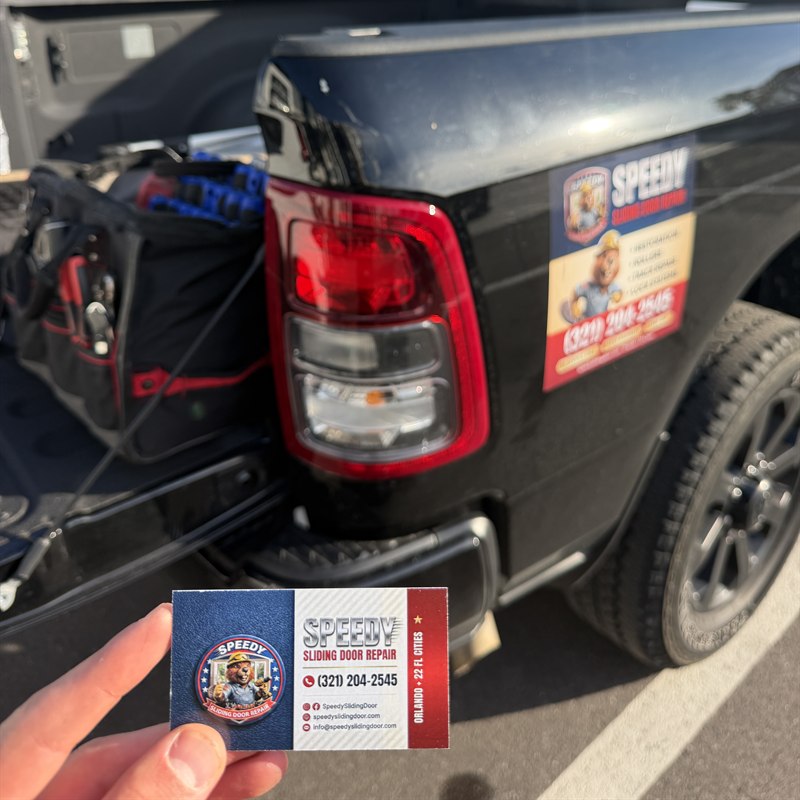 Speedy Sliding Door Repair branded pickup truck showing the Speedy beaver mascot magnet, services list and (321) 204-2545, plus a Speedy business card. Mobile sliding door repair across Central Florida