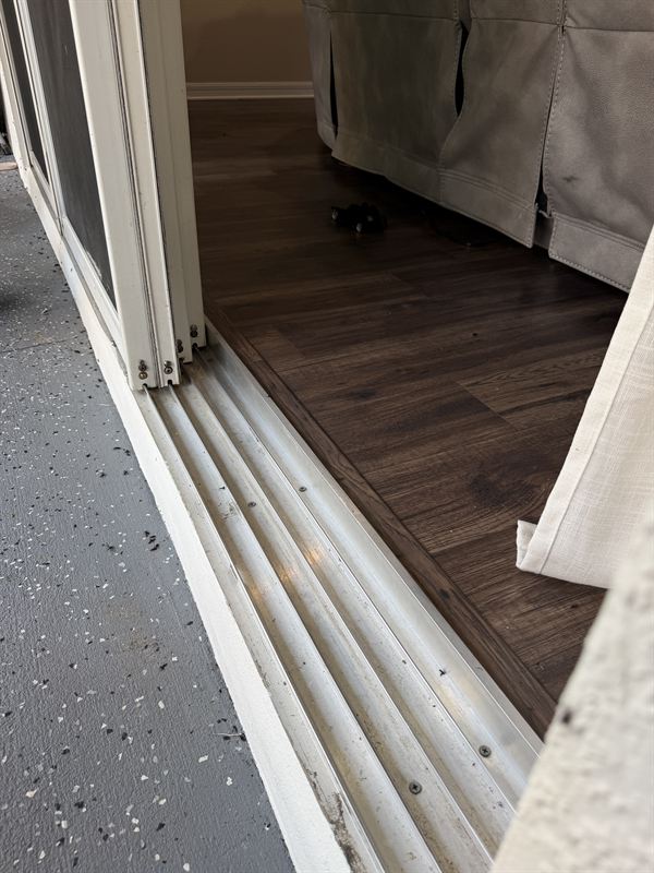 Same sliding door bottom track vacuumed clean and ready for new stainless rollers