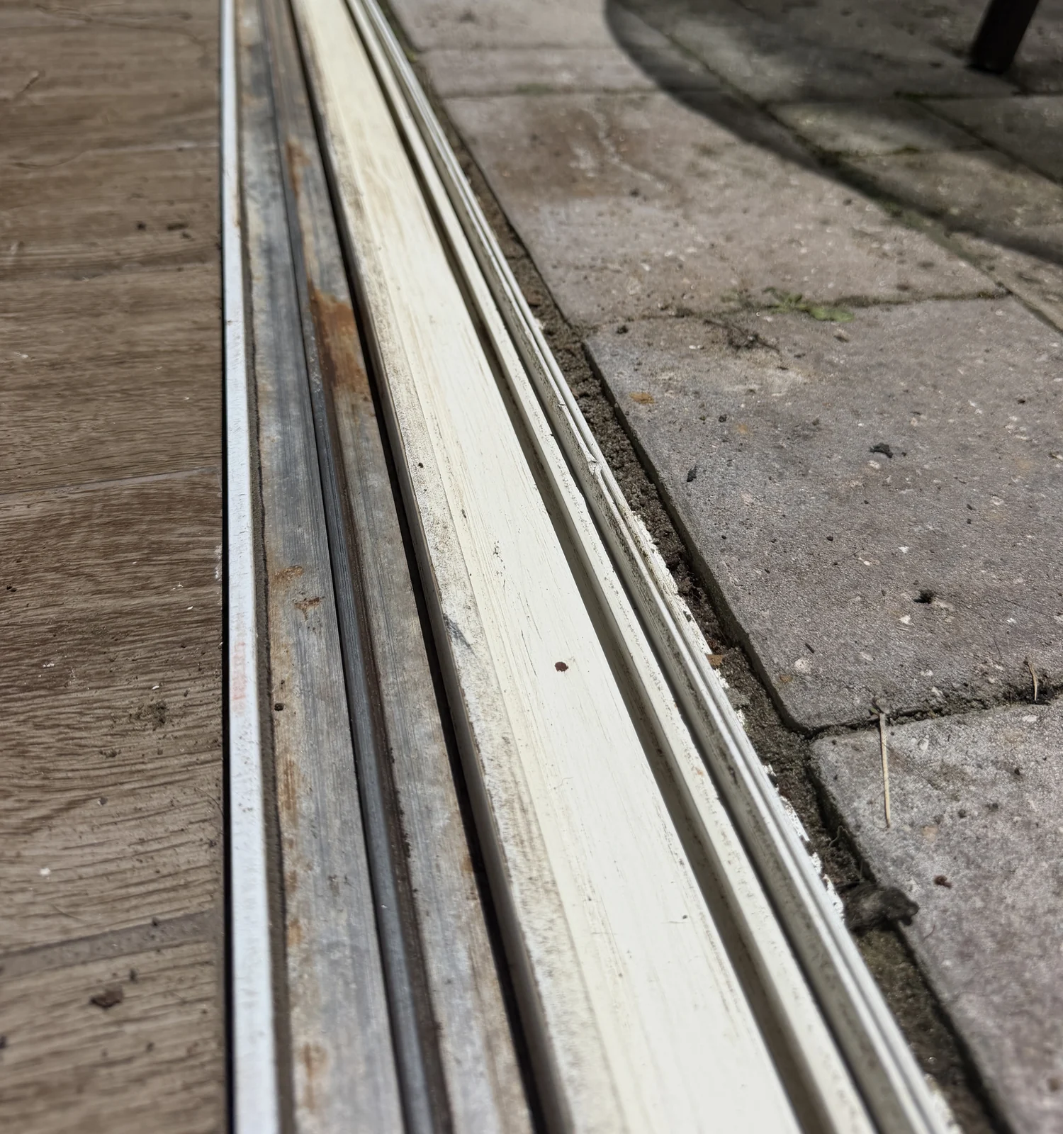 The same sliding door track cleaned and trued so rollers glide, Central Florida
