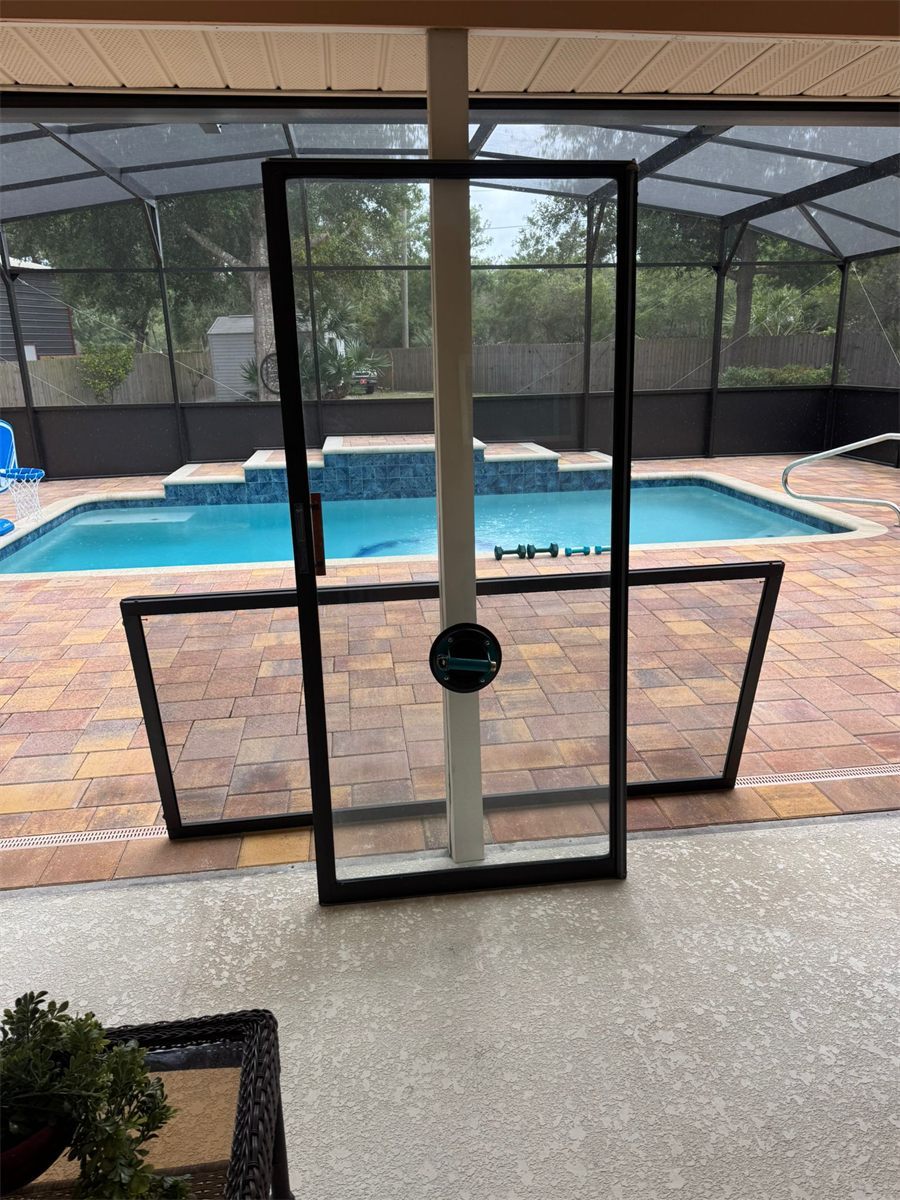 Sliding glass door panels removed during a full restoration job at a Florida pool home in Lake Mary